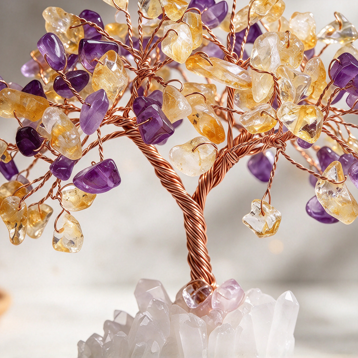 Close-up of the hand-twisted copper wire trunk and branches, with citrine and amethyst chips as leaves and Clear Quartz points below.