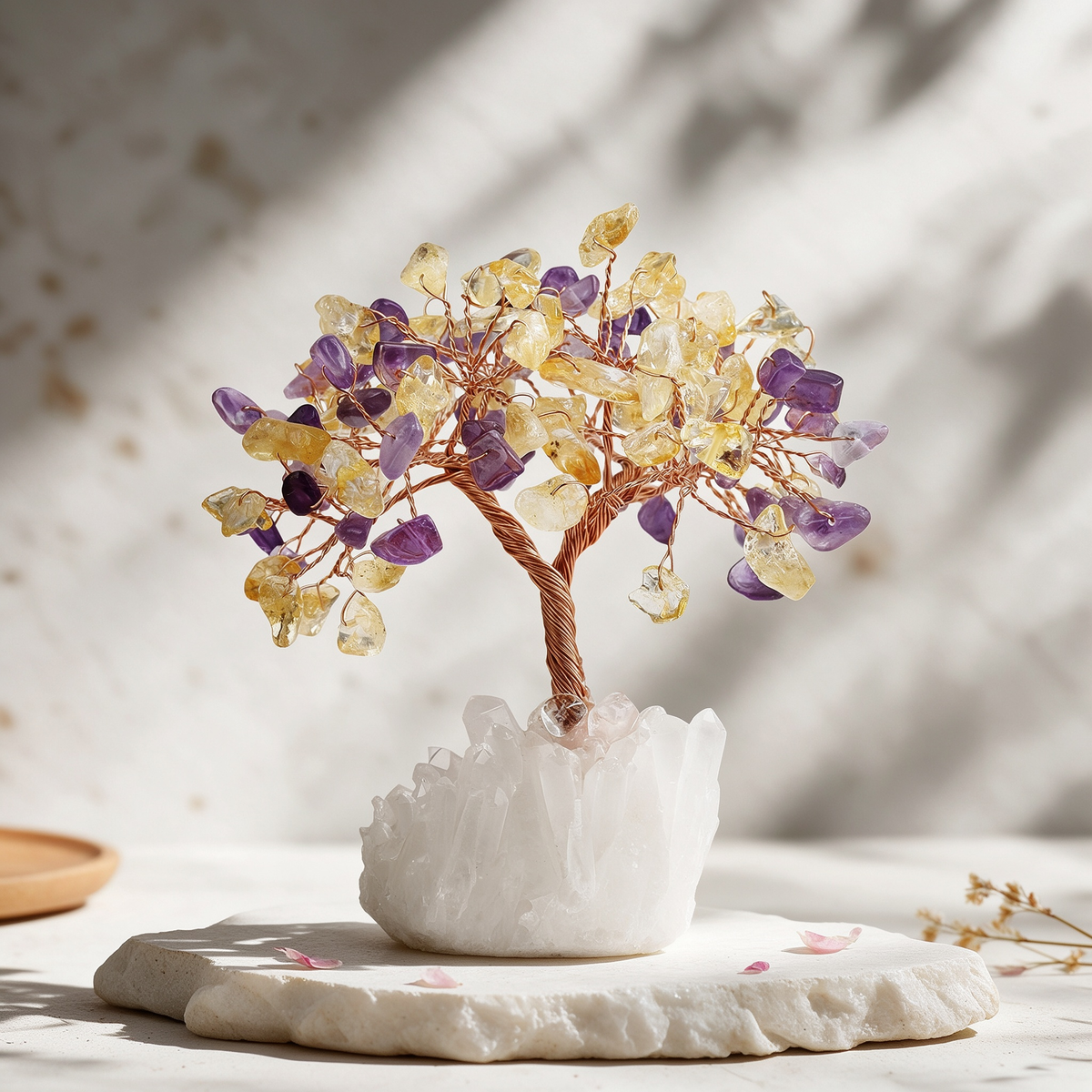 Citrine and Amethyst crystal tree with red copper wire branches on a Clear Quartz cluster base, displayed on a white stone slab in soft sunlight.